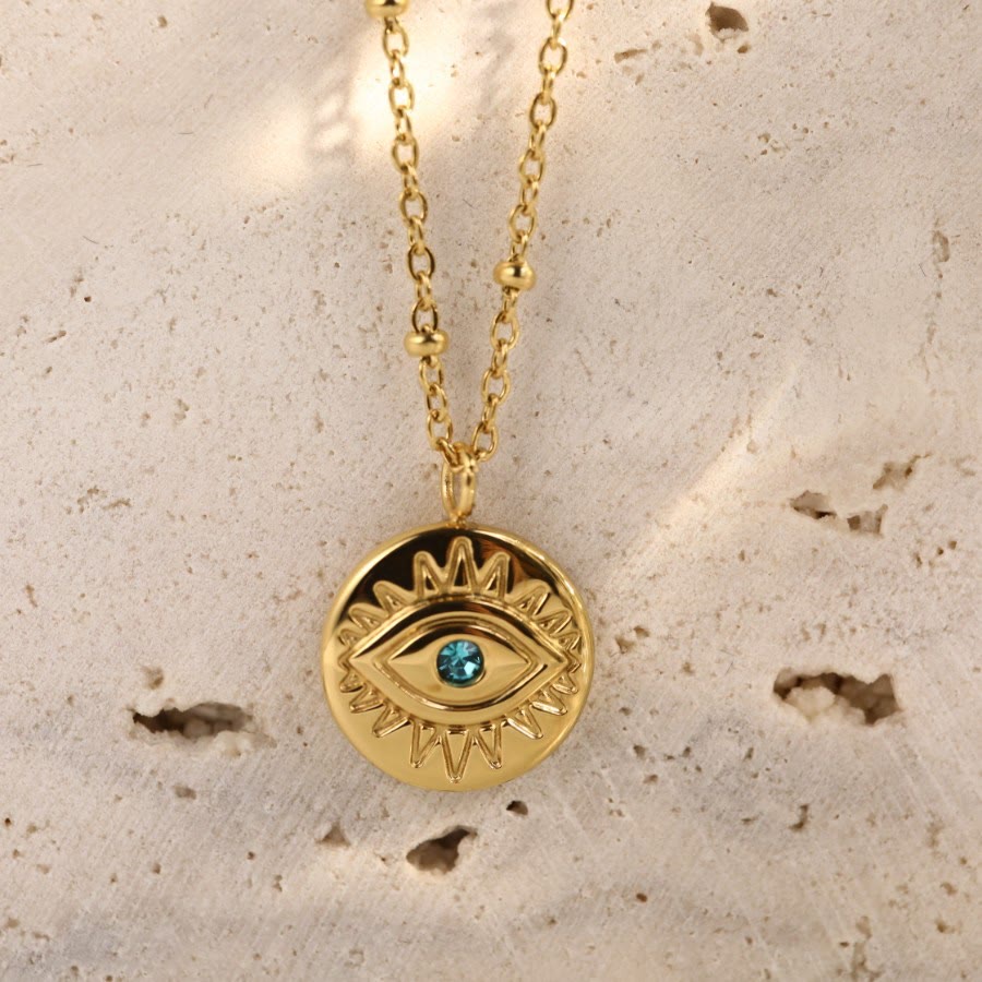 Collar de acero de titanio 316L con ojo malvado y topacio azul de Olivenorma