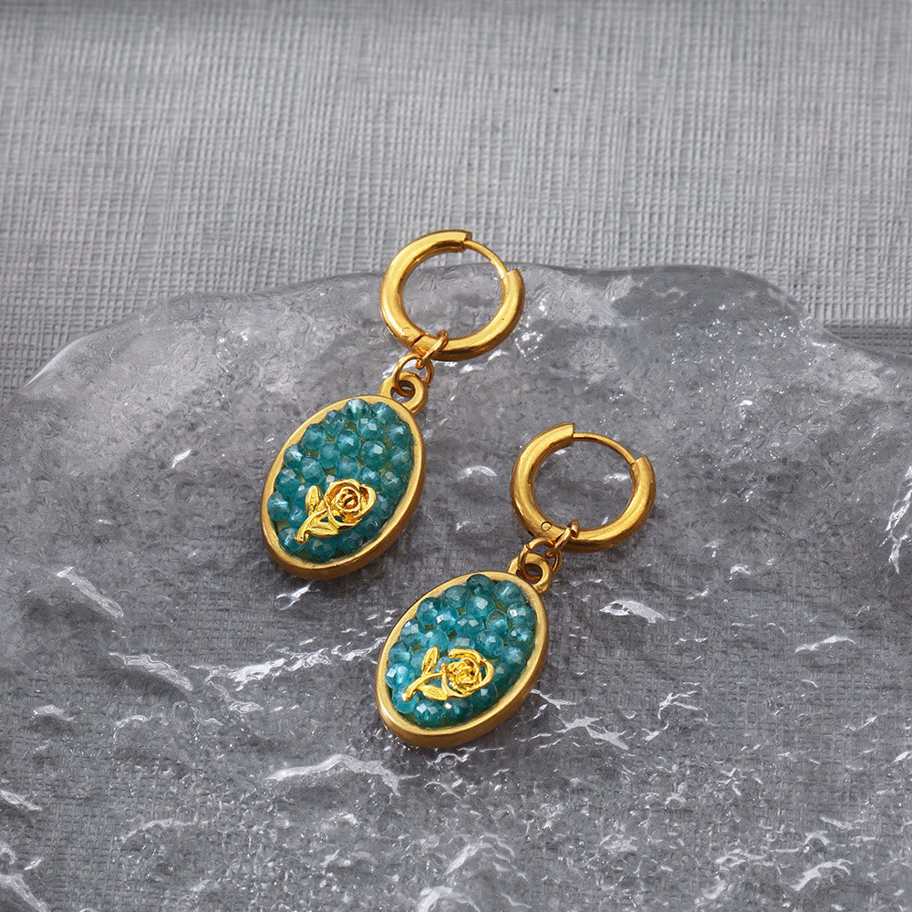 Pendientes colgantes ovalados con turmalina Paraiba y rosa triturada de Olivenorma
