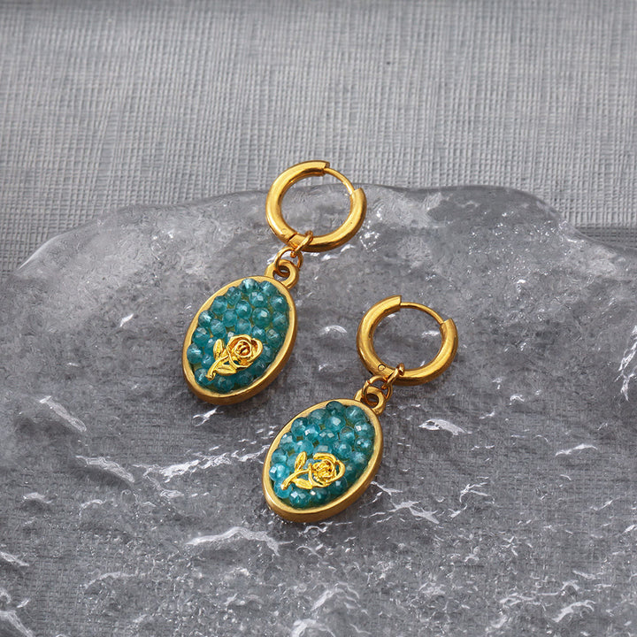 Pendientes colgantes ovalados con turmalina Paraiba y rosa triturada de Olivenorma
