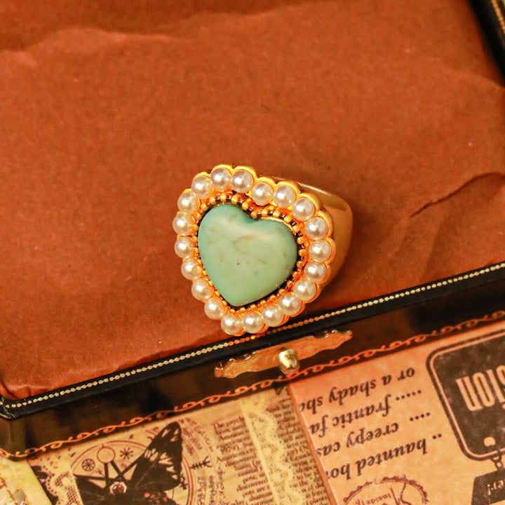 Anillo ajustable en forma de corazón con perla turquesa de Olivenorma 