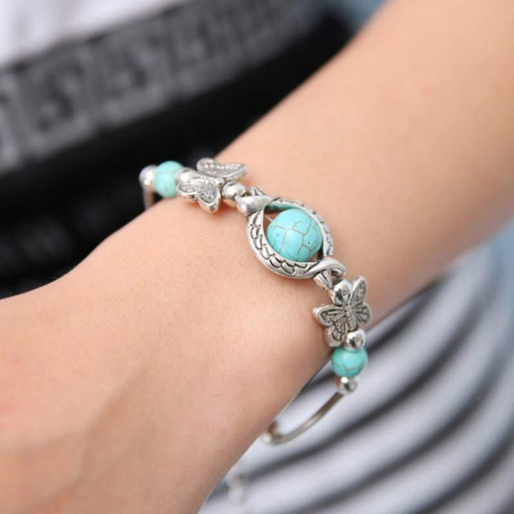 Pulsera de mariposa con esfera turquesa de Olivenorma
