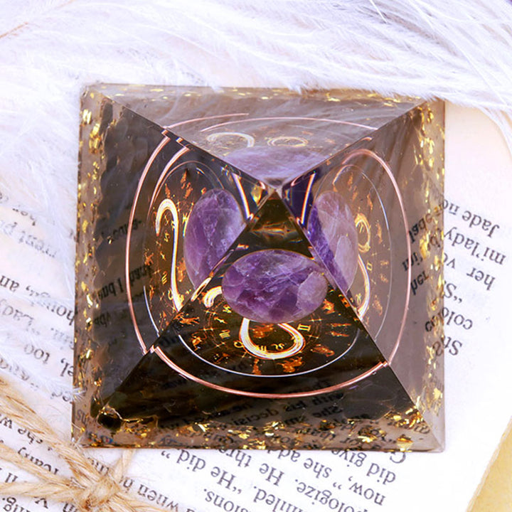 Pirámide de orgón del zodiaco Leo con esfera de amatista y obsidiana de Olivenorma 
