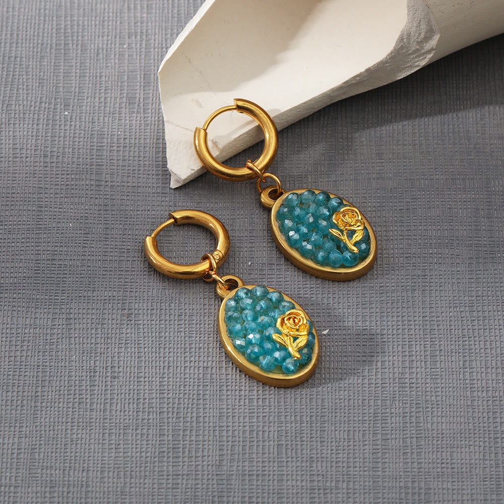 Pendientes colgantes ovalados con turmalina Paraiba y rosa triturada de Olivenorma