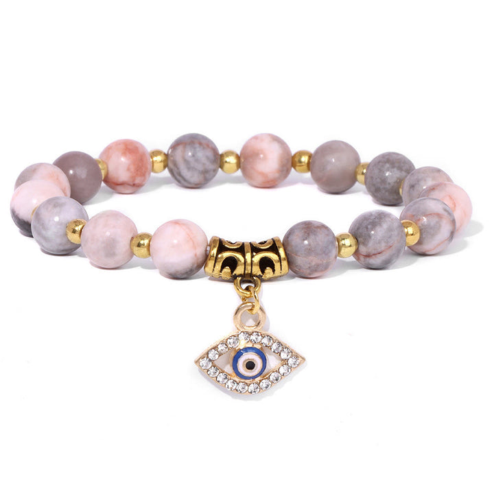Pulsera con colgante de ojo malvado y cuentas de piedra natural de Olivenorma