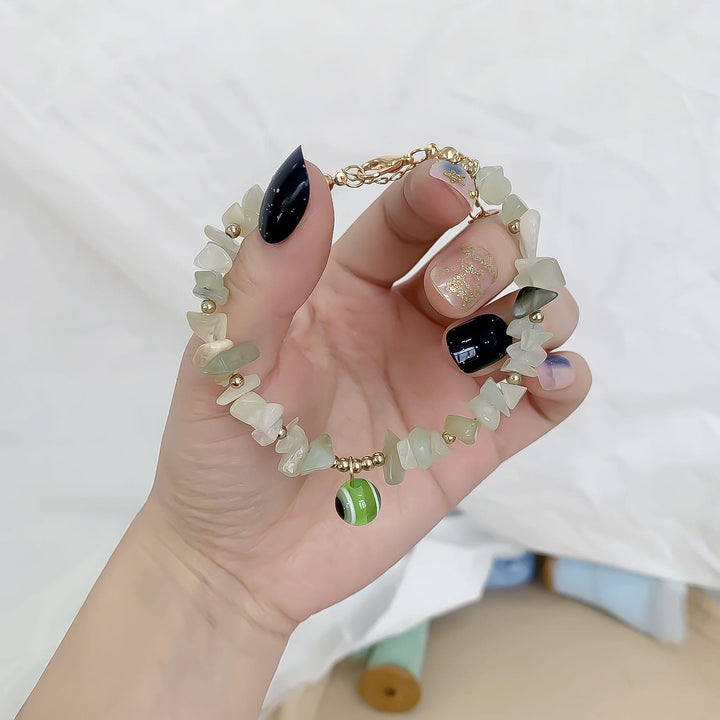 Pulsera con colgante de ojo malvado de grava de cristal natural de Olivenorma