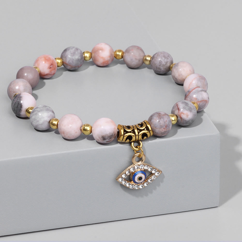 Pulsera con colgante de ojo malvado y cuentas de piedra natural de Olivenorma