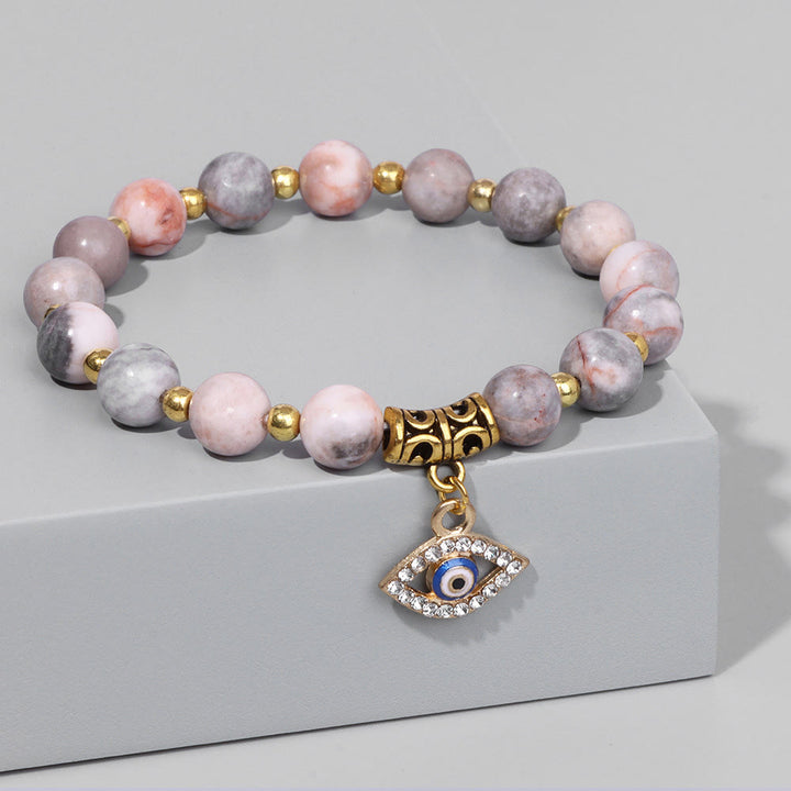 Pulsera con colgante de ojo malvado y cuentas de piedra natural de Olivenorma