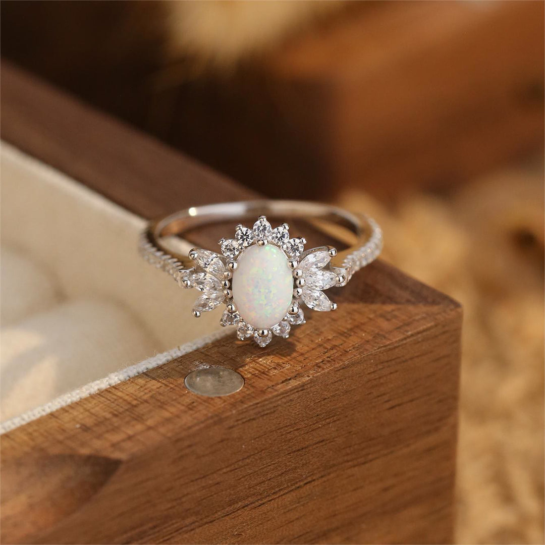 Anillo de plata 925 con diseño de girasol y ópalo azul blanco de Olivenorma 