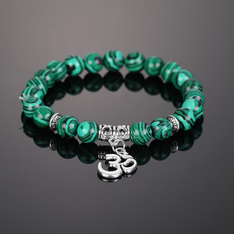 Pulsera con símbolo Om y cuentas de cristal natural de Olivenorma