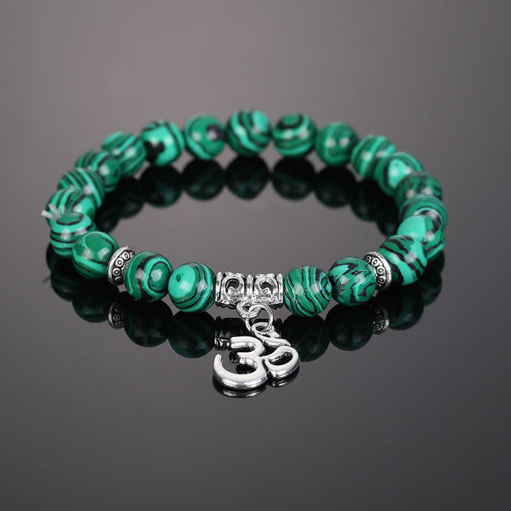 Pulsera con símbolo Om y cuentas de cristal natural de Olivenorma