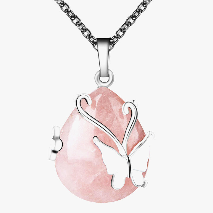 Collar de piedras preciosas con alas de mariposa de cristal.
