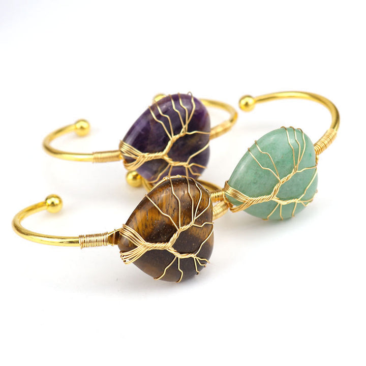 Pulsera de cristal natural en forma de corazón envuelta en alambre de cobre y oro de Olivenorma.