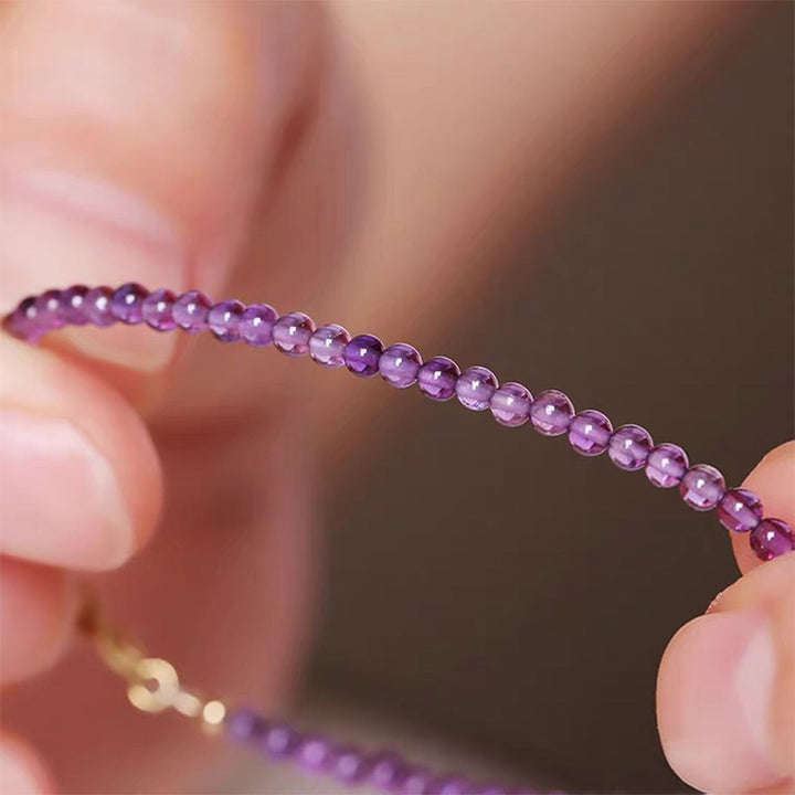 Pulsera de piedras preciosas curativas de amatista de Uruguay con puesta de sol morada de Olivenorma