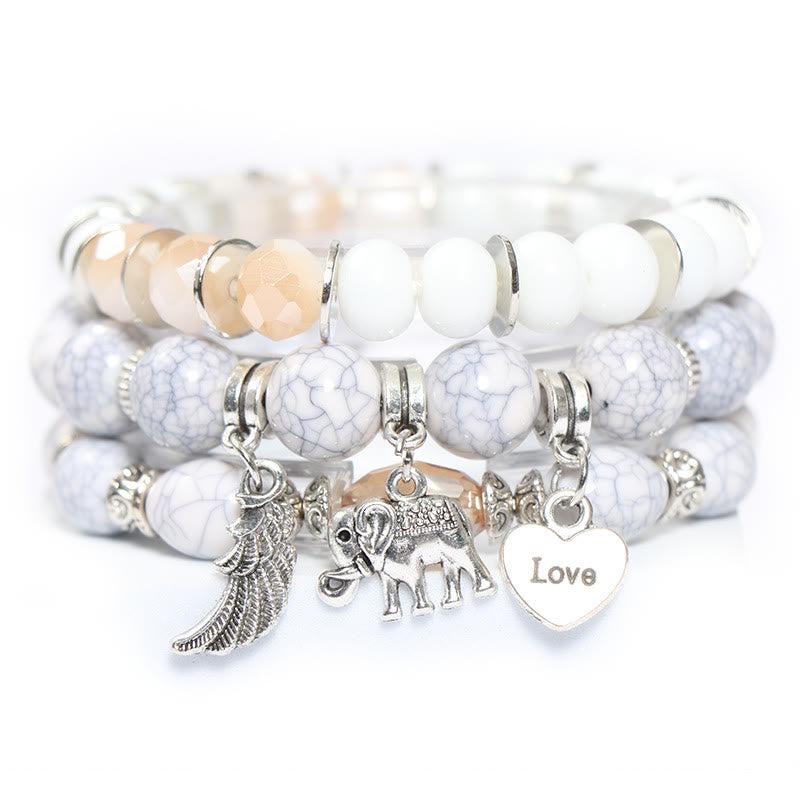 Juego de pulseras con cuentas y colgante de corazón con alas de elefante de Olivenorma 