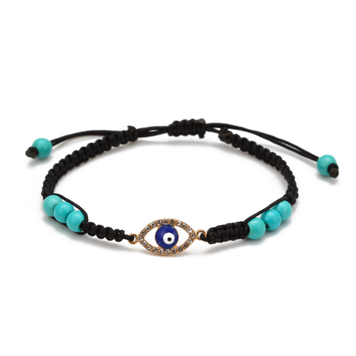 Pulsera trenzada ajustable con ojo malvado y circonita blanca y turquesa de Olivenorma 