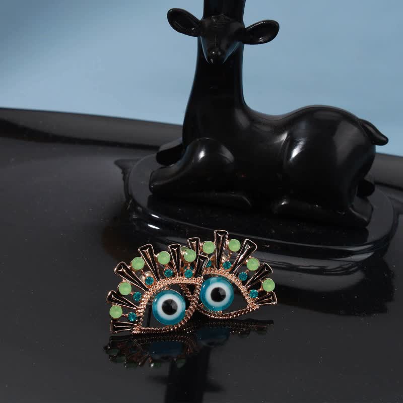 Pendientes creativos de pavo real con zafiro "Ojo de la perdición" de Olivenorma
