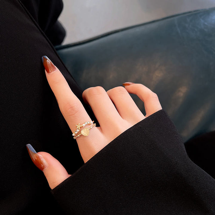 Anillo ajustable con piedra de ojo de gato y circonita blanca de Olivenorma 