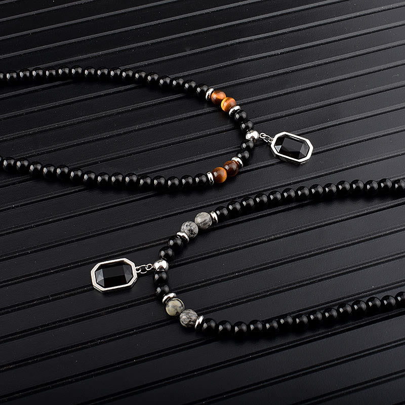 Collar de acero y titanio con cuentas de obsidiana y ojo de tigre para hombre de Olivenorma