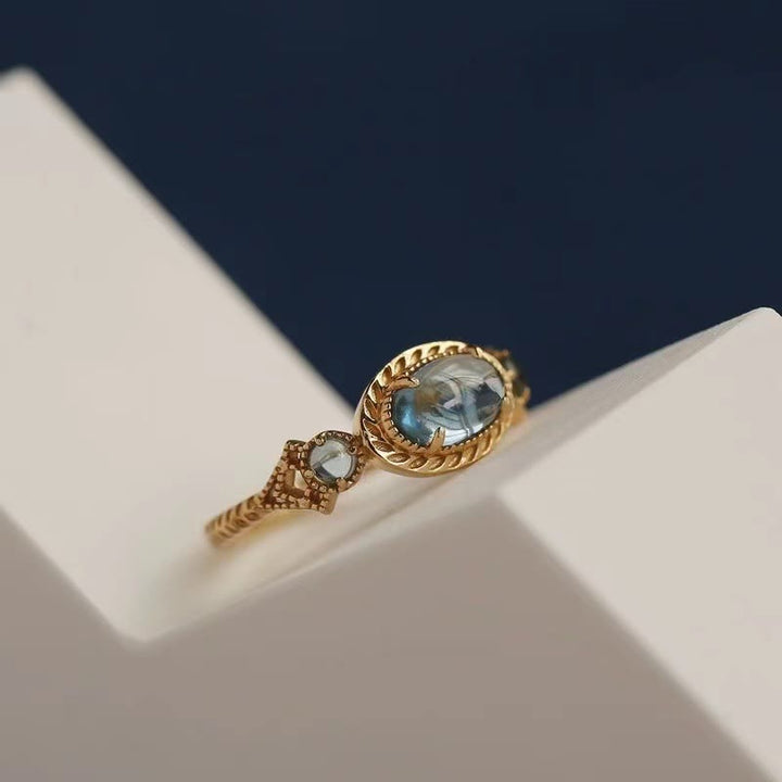 Anillo ajustable con piedra de topacio azul natural de Olivenorma