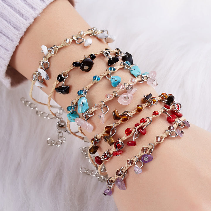 Pulsera trenzada con borlas de obsidiana, ojo de tigre y amatista de Olivenorma