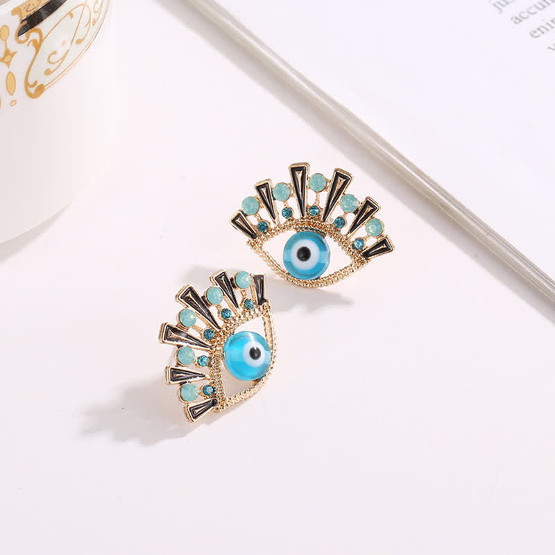 Pendientes creativos de pavo real con zafiro "Ojo de la perdición" de Olivenorma