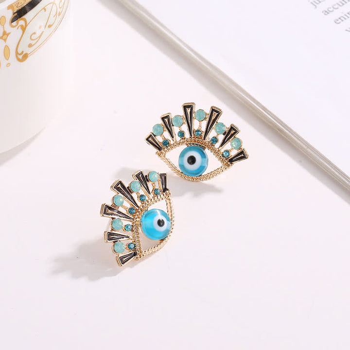 Pendientes creativos de pavo real con zafiro "Ojo de la perdición" de Olivenorma