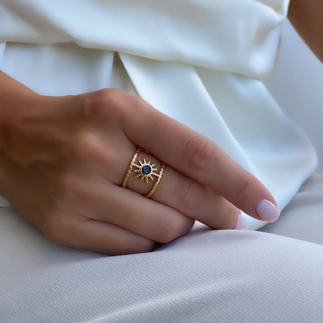 Anillo de gemas con estrella de ocho puntas y doble hilera de girasol de Olivenorma