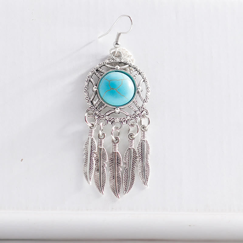 Pendientes de borlas con plumas de plata y turquesa de Olivenorma