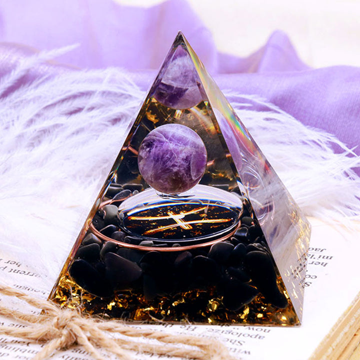 Pirámide de orgón del zodiaco Piscis con esfera de amatista y obsidiana de Olivenorma 