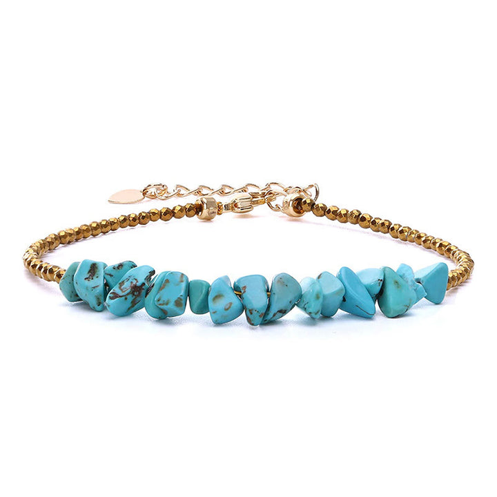 Pulsera de cuentas turquesas con cadena dorada de Olivenorma 