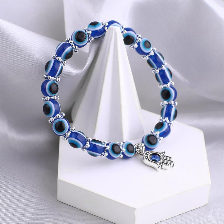 Pulsera curativa con símbolo de mal de ojo y hamsa