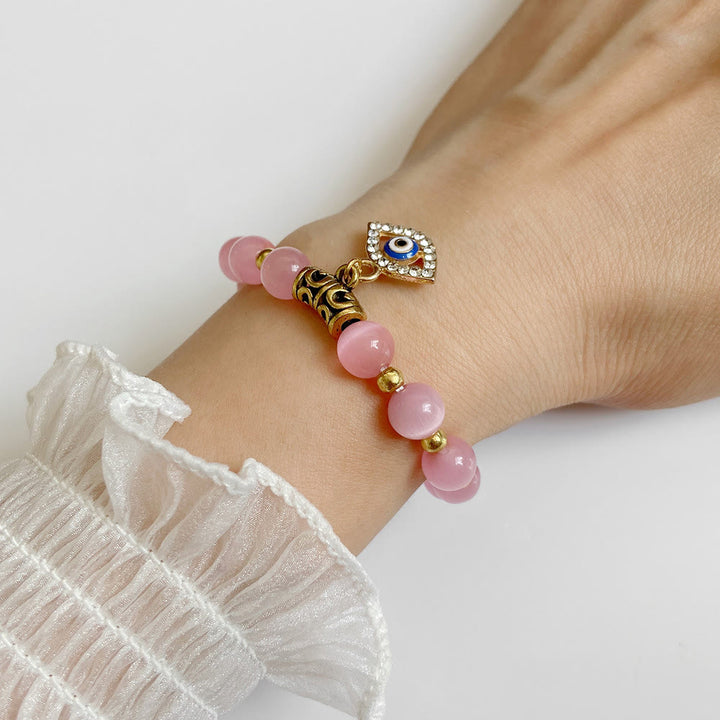 Pulsera con colgante de ojo malvado y cuentas de piedra natural de Olivenorma