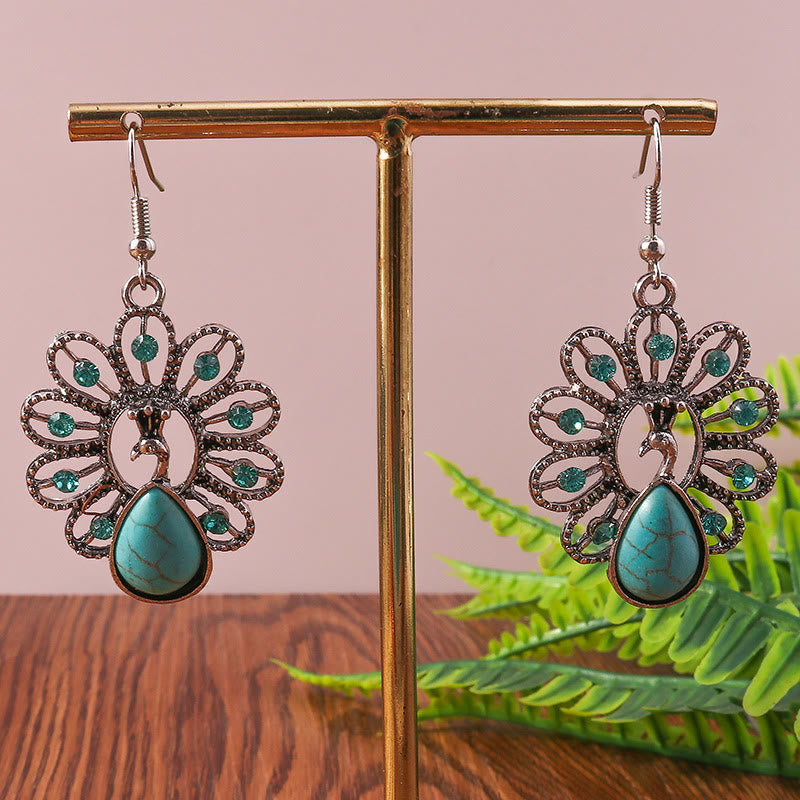 Pendientes colgantes en forma de pavo real con turmalina Paraiba y turquesa de Olivenorma