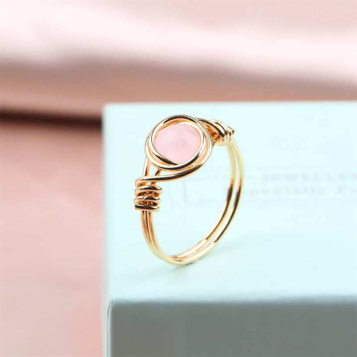 Anillo de cristal curativo envuelto en alambre