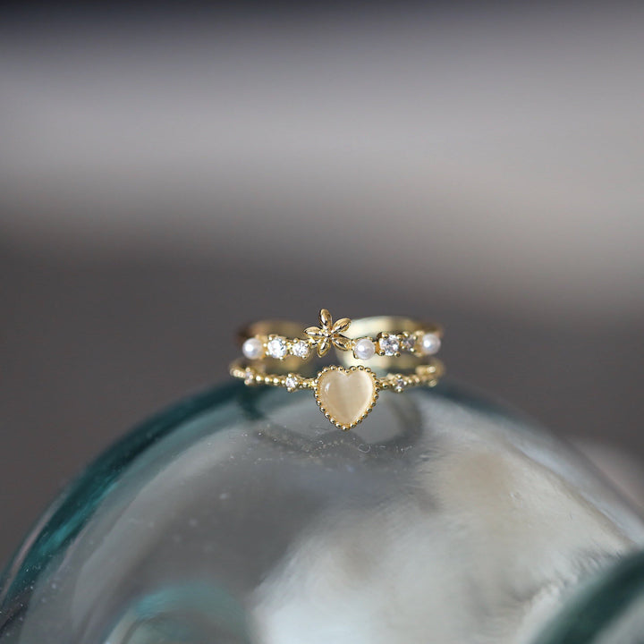 Anillo ajustable con piedra de ojo de gato y circonita blanca de Olivenorma 