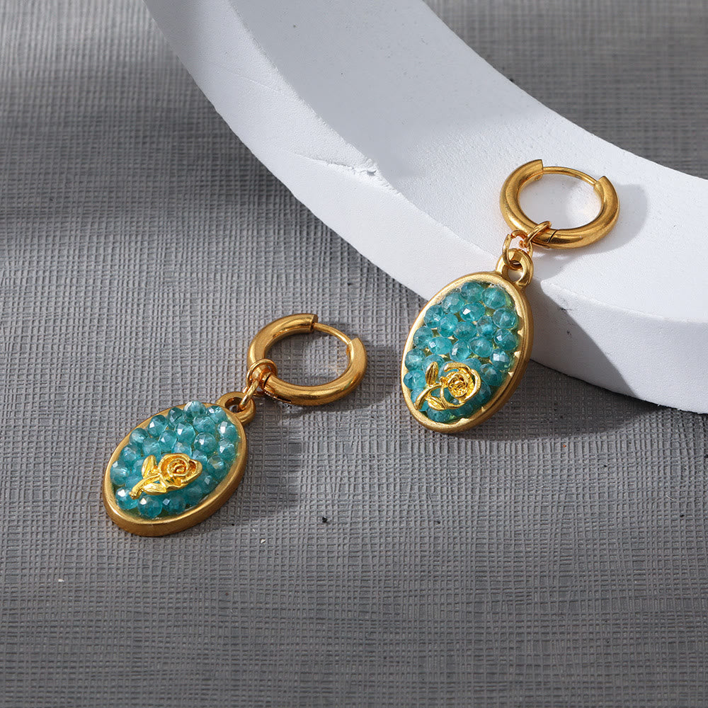 Pendientes colgantes ovalados con turmalina Paraiba y rosa triturada de Olivenorma