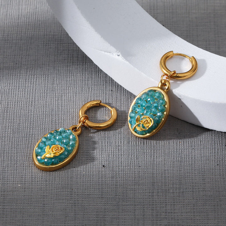 Pendientes colgantes ovalados con turmalina Paraiba y rosa triturada de Olivenorma