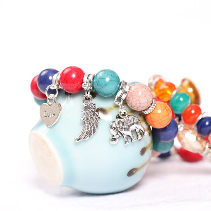 Juego de pulseras con cuentas y colgante de corazón con alas de elefante de Olivenorma 