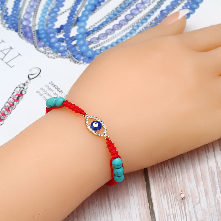 Pulsera trenzada ajustable con ojo malvado y circonita blanca y turquesa de Olivenorma 