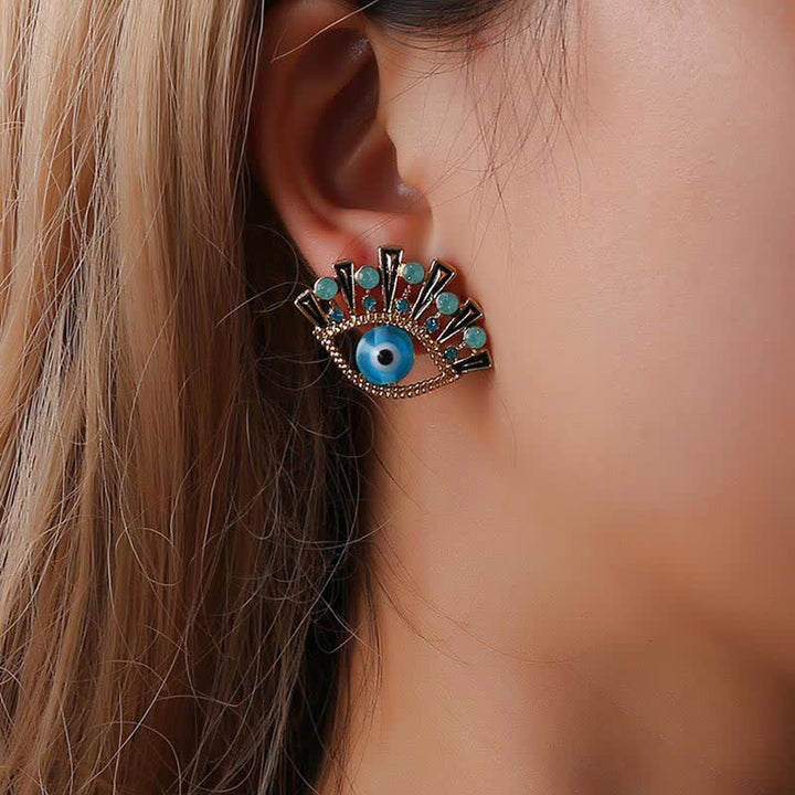 Pendientes creativos de pavo real con zafiro "Ojo de la perdición" de Olivenorma