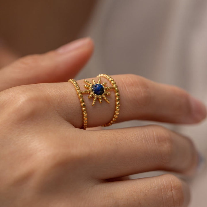 Anillo de gemas con estrella de ocho puntas y doble hilera de girasol de Olivenorma