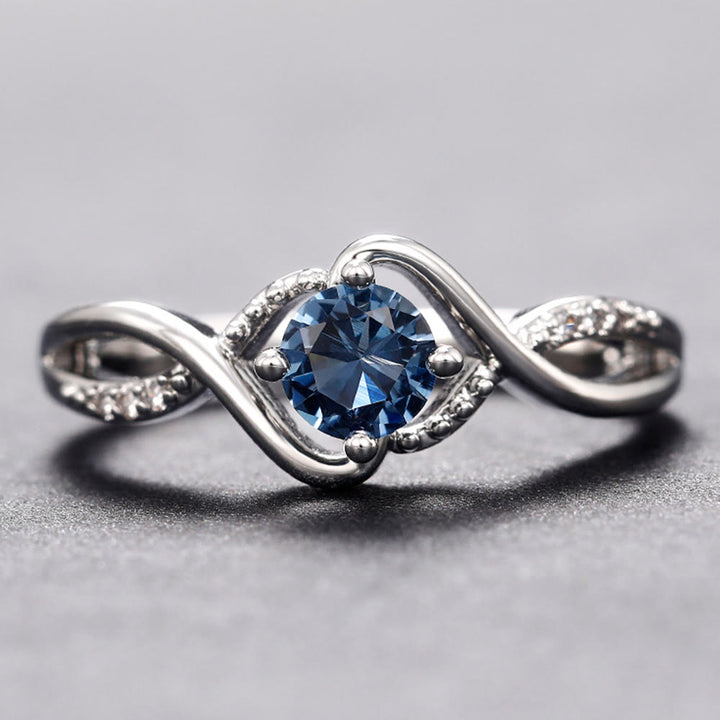 Anillo de compromiso de alejandrita azul en forma de onda de Olivenorma