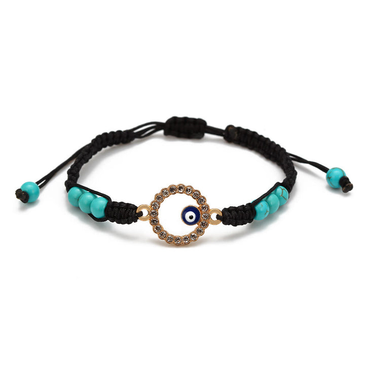 Pulsera trenzada ajustable con ojo malvado y circonita blanca y turquesa de Olivenorma 