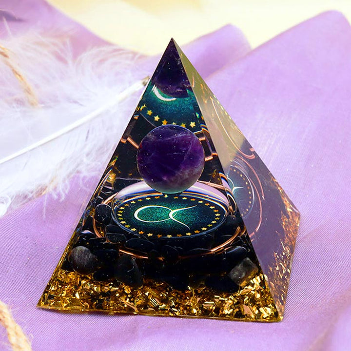 Pirámide de orgón del zodiaco Tauro con esfera de amatista y obsidiana de Olivenorma 