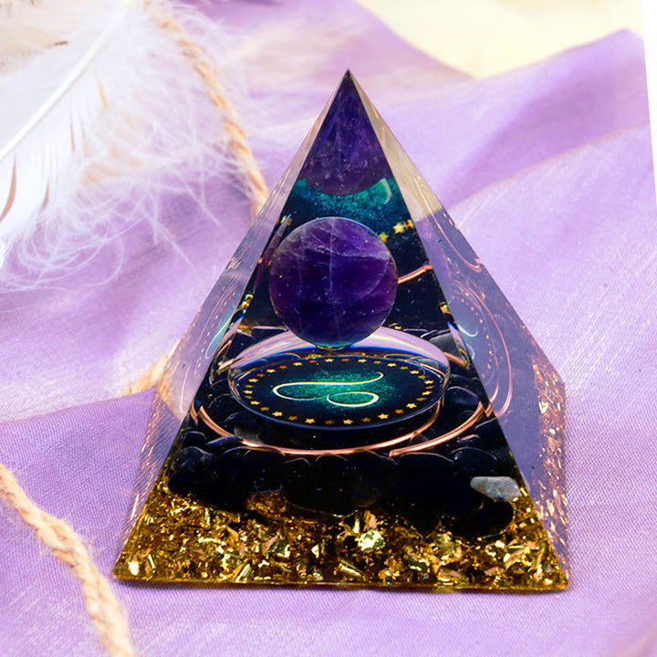 Pirámide de orgón del zodiaco Leo con esfera de amatista y obsidiana de Olivenorma 