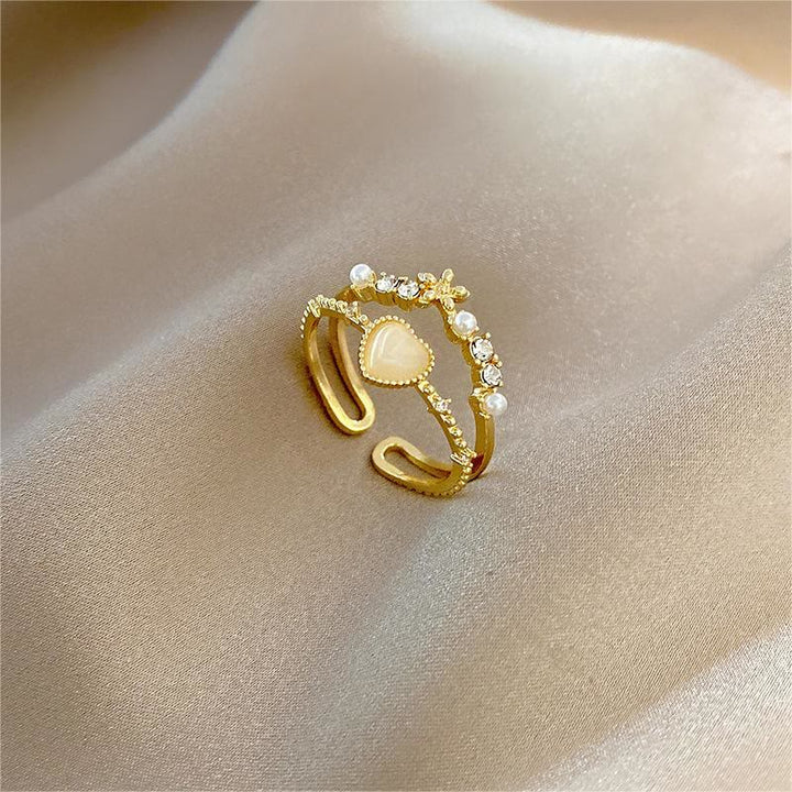 Anillo ajustable con piedra de ojo de gato y circonita blanca de Olivenorma 