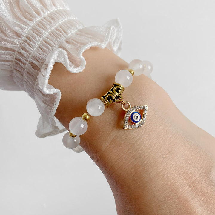 Pulsera con colgante de ojo malvado y cuentas de piedra natural de Olivenorma