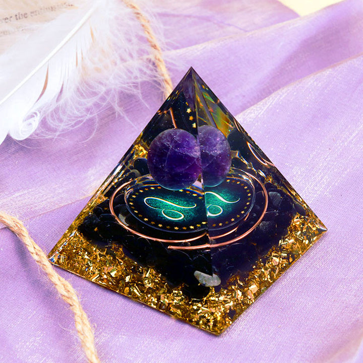 Pirámide de orgón del zodiaco Leo con esfera de amatista y obsidiana de Olivenorma 