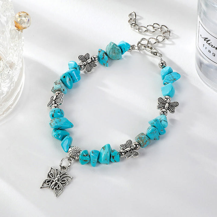 Pulsera con dije de mariposa de escombros de cristal colorido de Olivenorma