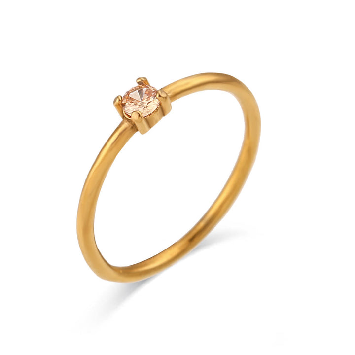 Anillo de acero inoxidable chapado en oro de 18 quilates con piedra natal simple de Olivenorma